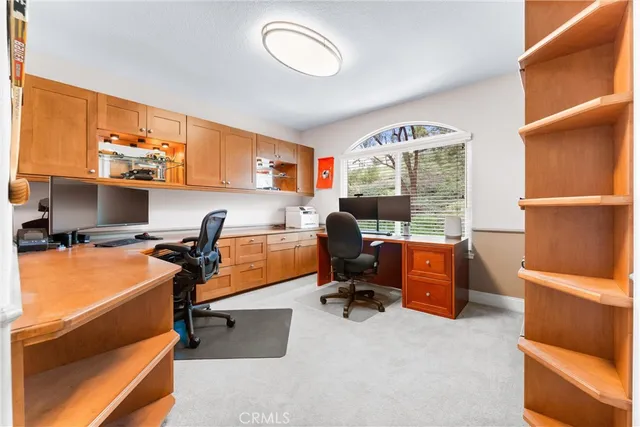 a bedroom with furniture and a flat screen tv