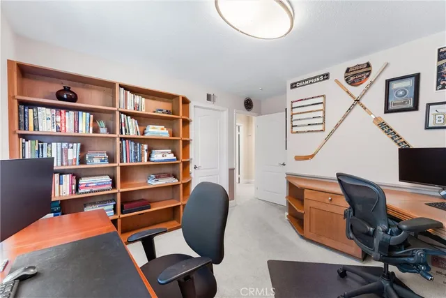 a view of a patio with dining table and chairs