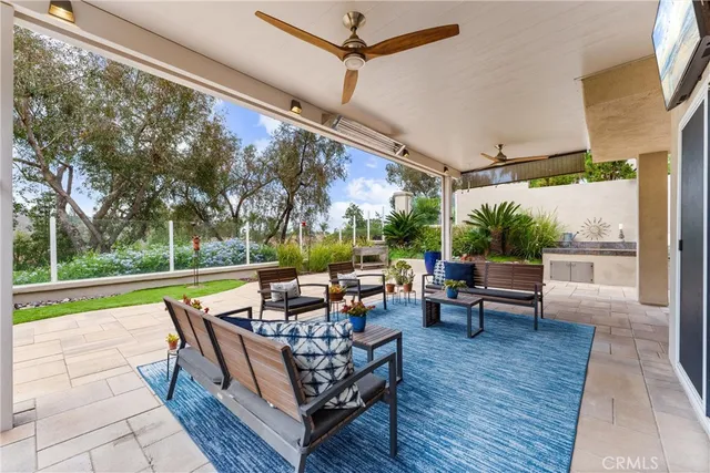 a view of a backyard with sitting area and furniture