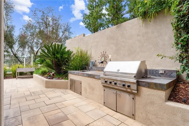 a view of a patio with a dining table and chairs with a patio