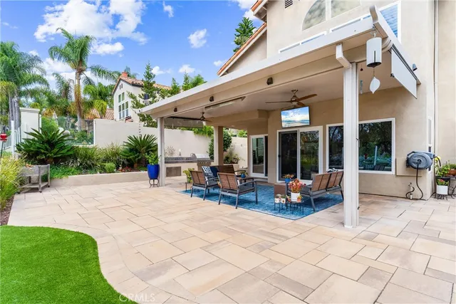 a view of a backyard with sitting area and furniture