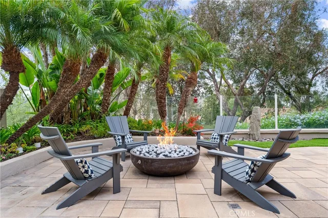 a view of a house with sitting area and garden