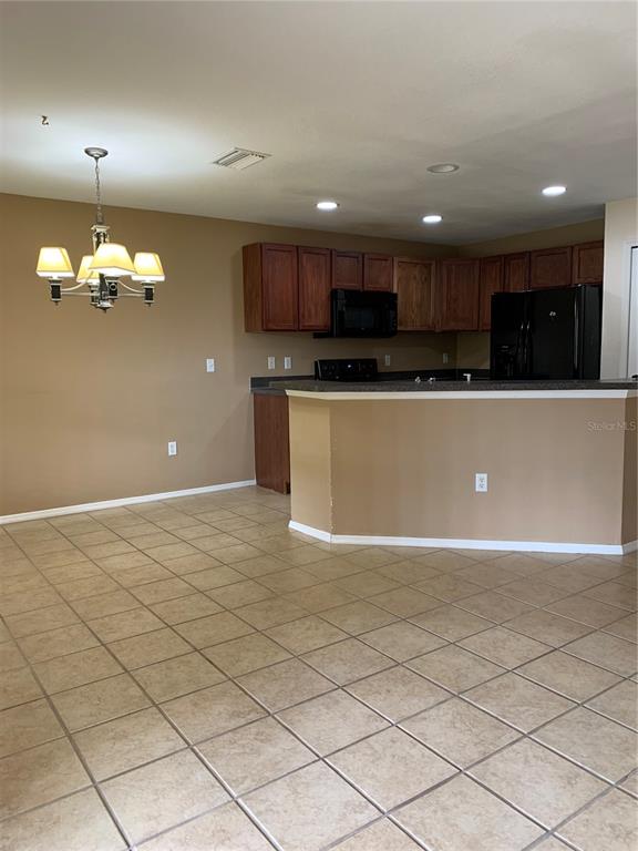 1531 Water Terrace Lane Brandon, FL 33511 - Photo 6 of 14 a view of kitchen with stainless steel appliances granite countertop a refrigerator and a stove top oven