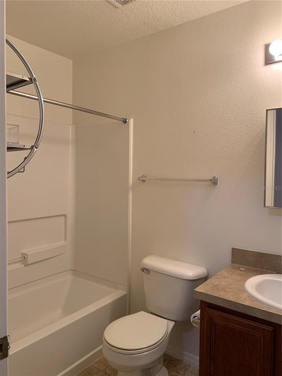 1531 Water Terrace Lane Brandon, FL 33511 - Photo 10 of 14 a white toilet and tub sitting next to a bathroom sink