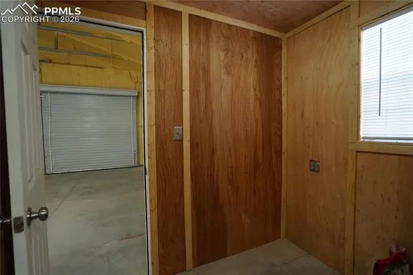 a bathroom with a shower and a door