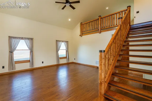 a view of an entryway with wooden floor