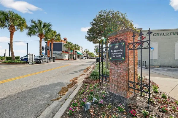 a city street lined with buildings and trees