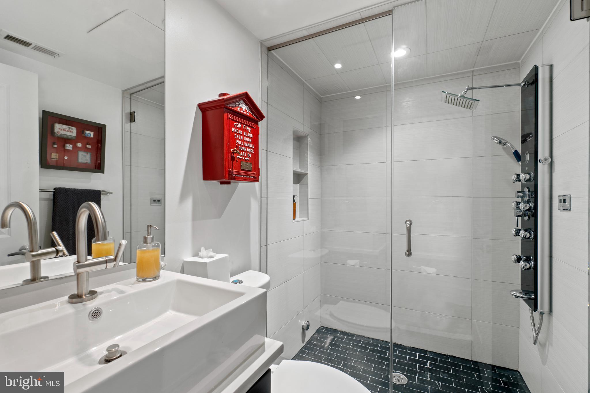 1818 1st Street Northwest, Unit 2 Washington, DC 20001 - Photo 14 of 45 Main level full bath with steam shower