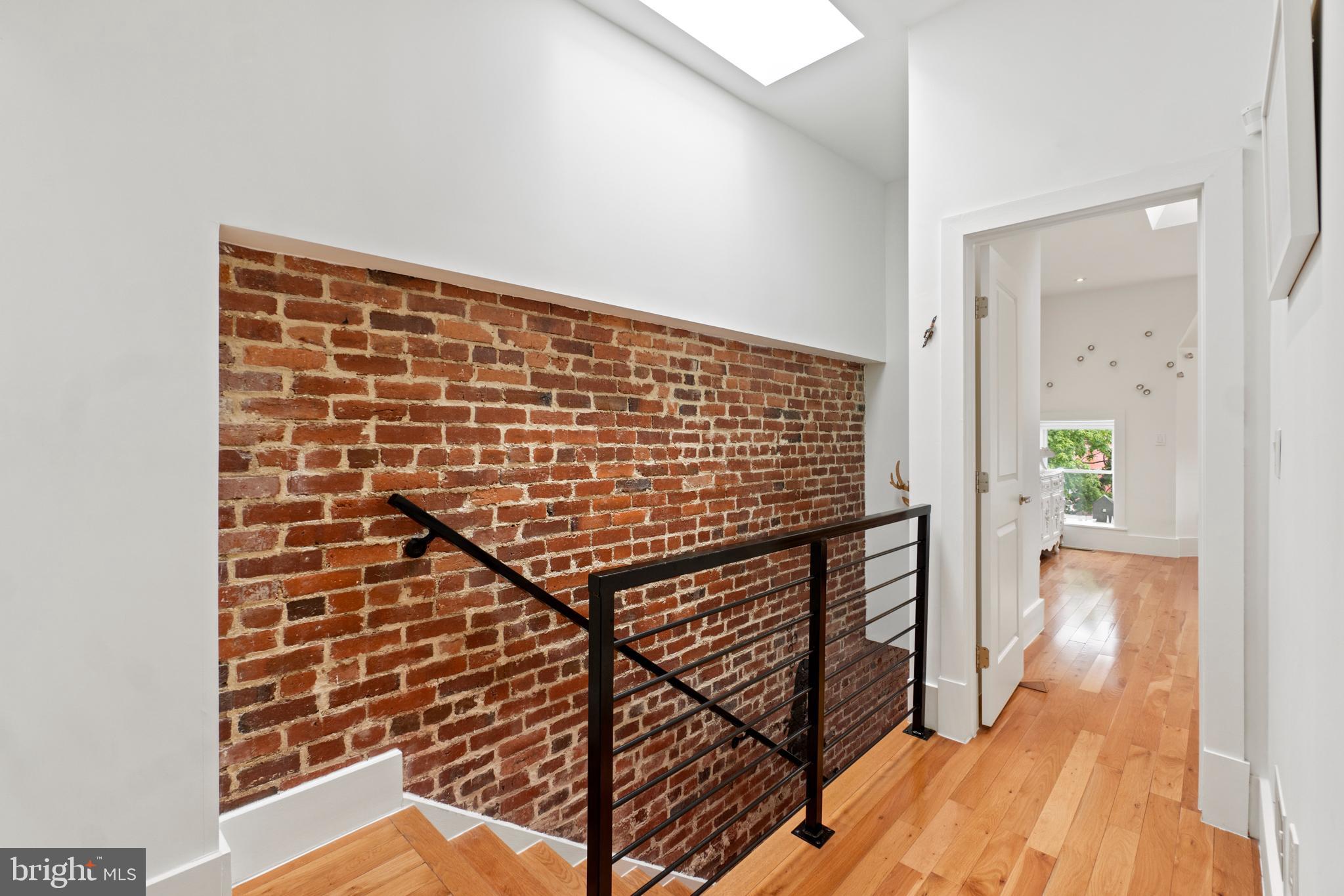 1818 1st Street Northwest, Unit 2 Washington, DC 20001 - Photo 32 of 45 Upper level hallway with skylight & extra closet