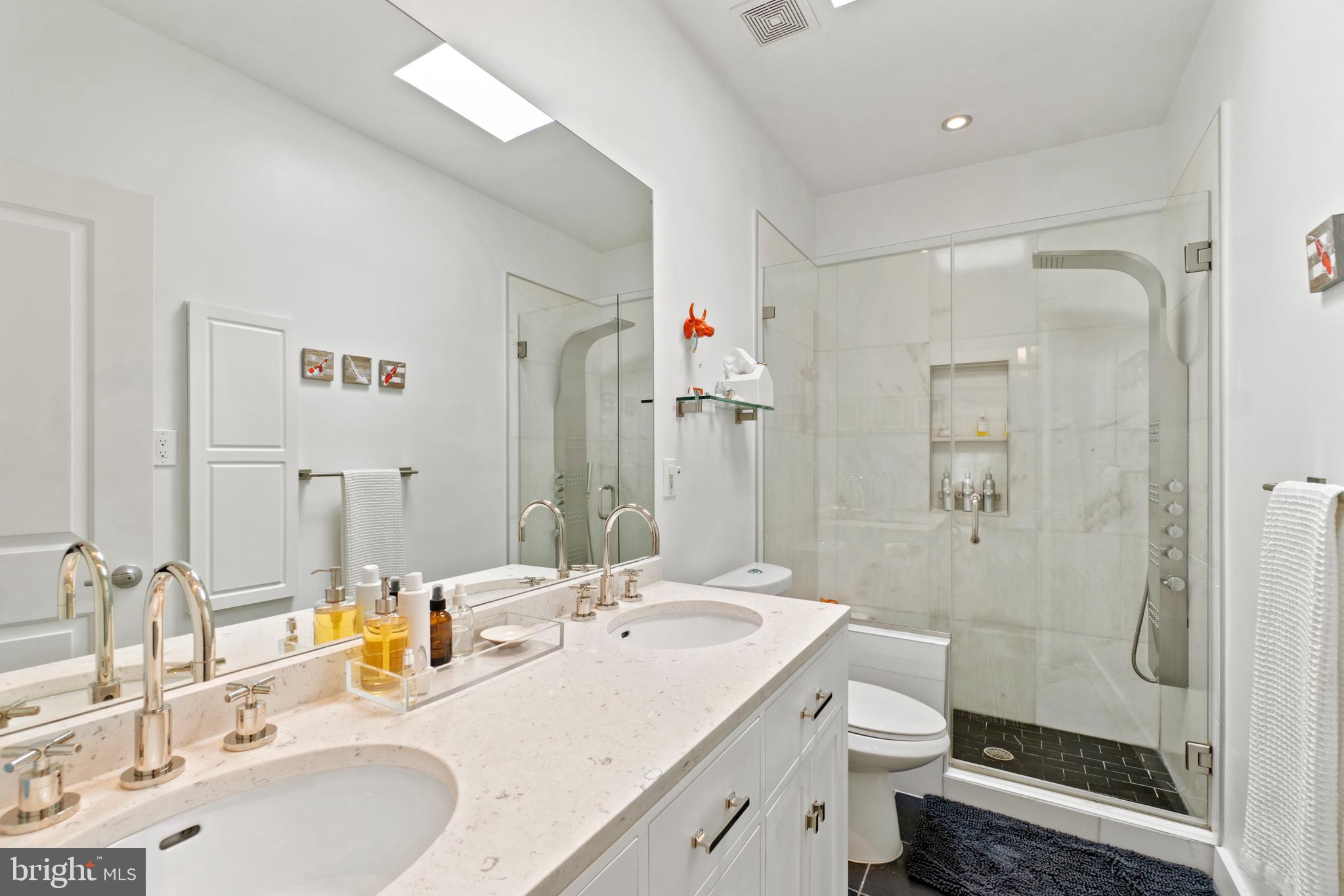 1818 1st Street Northwest, Unit 2 Washington, DC 20001 - Photo 39 of 45 Double vanity, Carrera marble shower