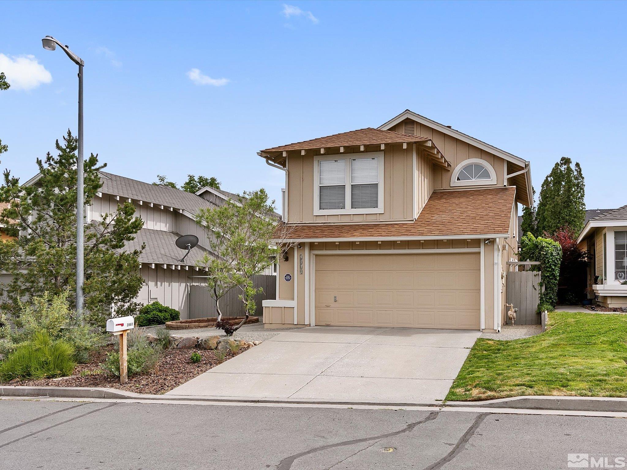 2860 Alpine Creek Road Reno, NV 89519 - Photo 39 of 39 a front view of a house with a yard and garage