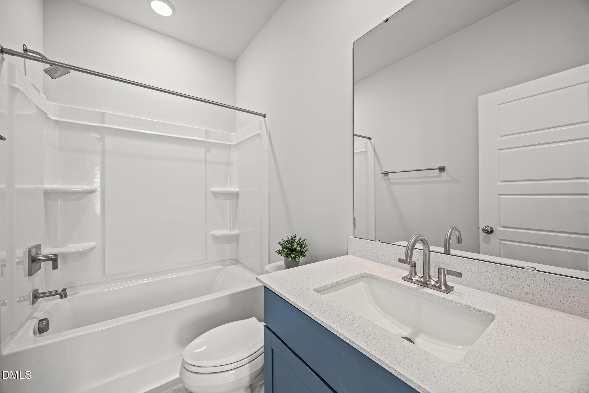 501 Hedrick Ridge Road Cary, NC 27519 - Photo 32 of 47 a bathroom with a bathtub shower sink vanity mirror and toilet