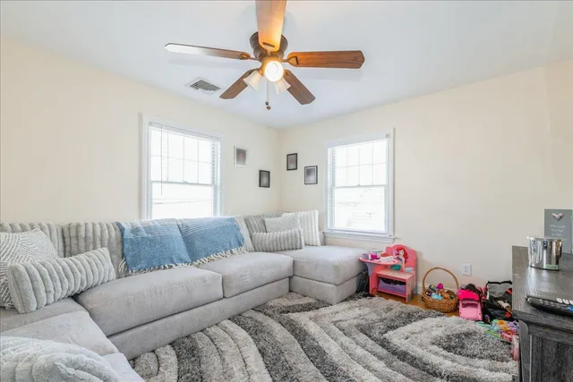 a bedroom with furniture and a window