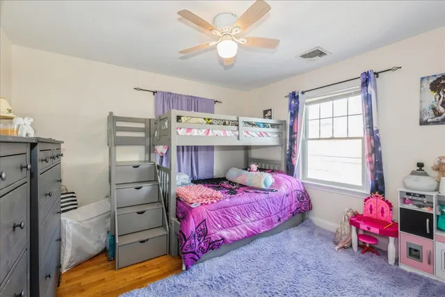 a bedroom with a bed and furniture