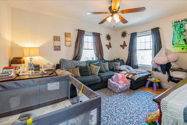 a living room with furniture and a window
