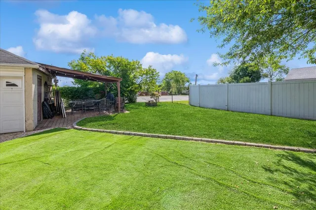 a view of a backyard with garden