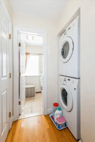 a view of a bedroom with washer and dryer