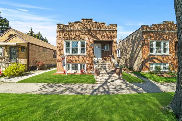 front view of a house with a yard