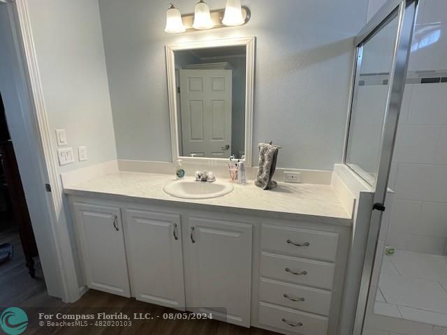Park City Davie, FL 33324 - Photo 16 of 22 a bathroom with a sink and a mirror