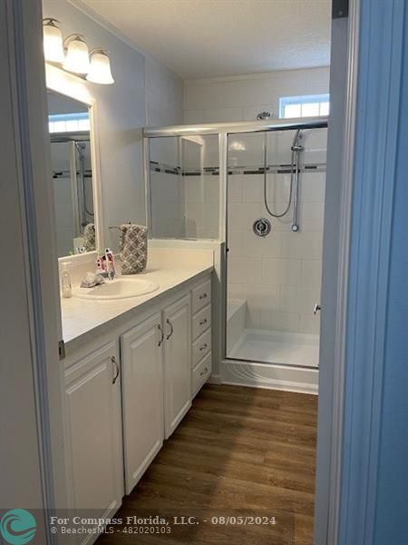 Park City Davie, FL 33324 - Photo 22 of 22 a bathroom with a shower sink and mirror