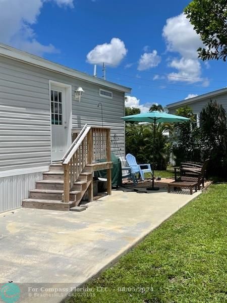 Park City Davie, FL 33324 - Photo 6 of 22 a view of a house with backyard porch and sitting area