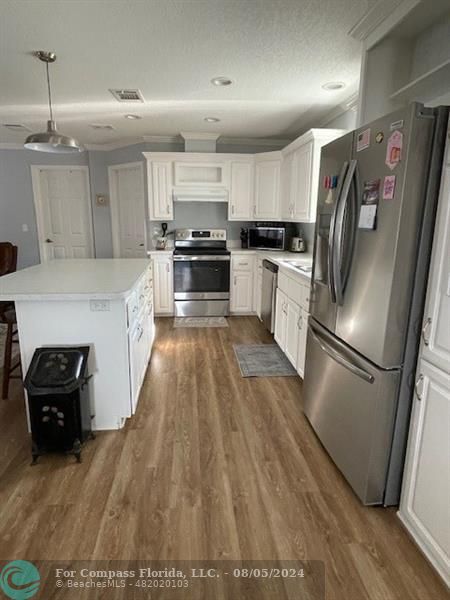 Park City Davie, FL 33324 - Photo 9 of 22 a kitchen with granite countertop a refrigerator oven and a sink
