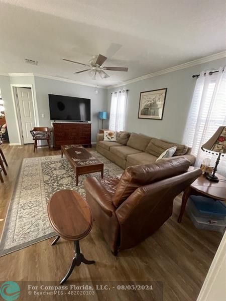 Park City Davie, FL 33324 - Photo 10 of 22 a living room with furniture a flat screen tv and a rug