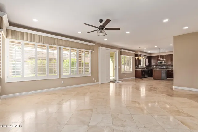 a large kitchen with kitchen island a large island in it