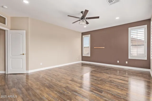 a spacious bathroom with a granite countertop tub sink and a mirror