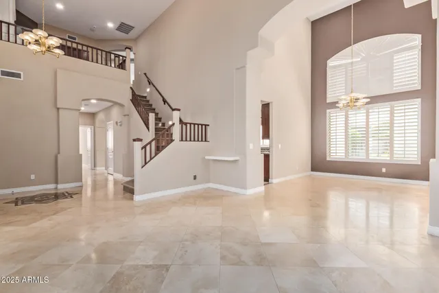 a view of an empty room with windows