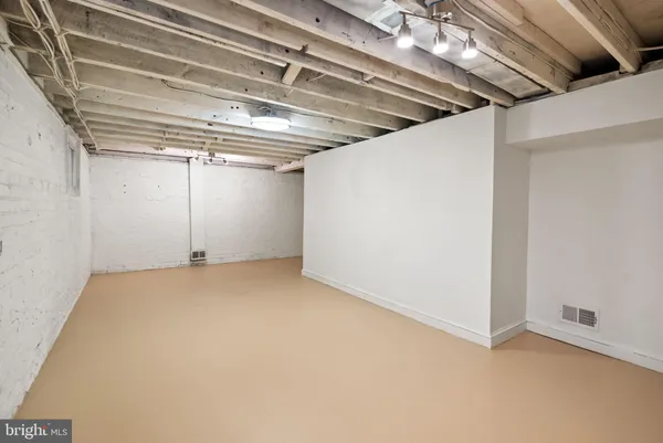 a view of a room with an empty space