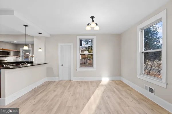a view of a kitchen from the hallway