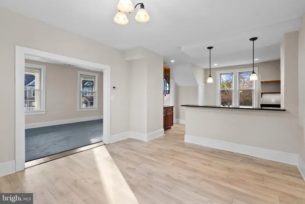 a view of a kitchen with a sink and a window