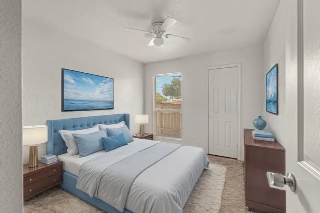 a bedroom with bed and window