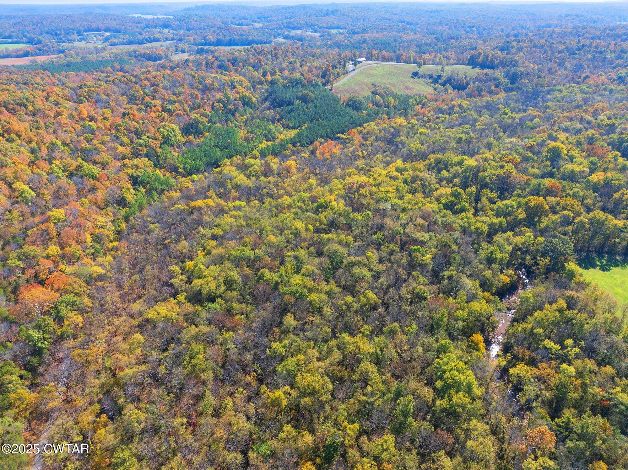 0 Dr Fisher Lane Decaturville, TN 38329 - Photo 12 of 25 an aerial view of residential houses with outdoor space and trees