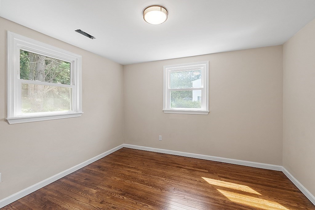 621 Boston Road Billerica, MA 01821 - Photo 11 of 27 a view of empty room with wooden floor and fan