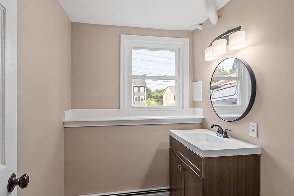 621 Boston Road Billerica, MA 01821 - Photo 20 of 27 a bathroom with a sink and a mirror