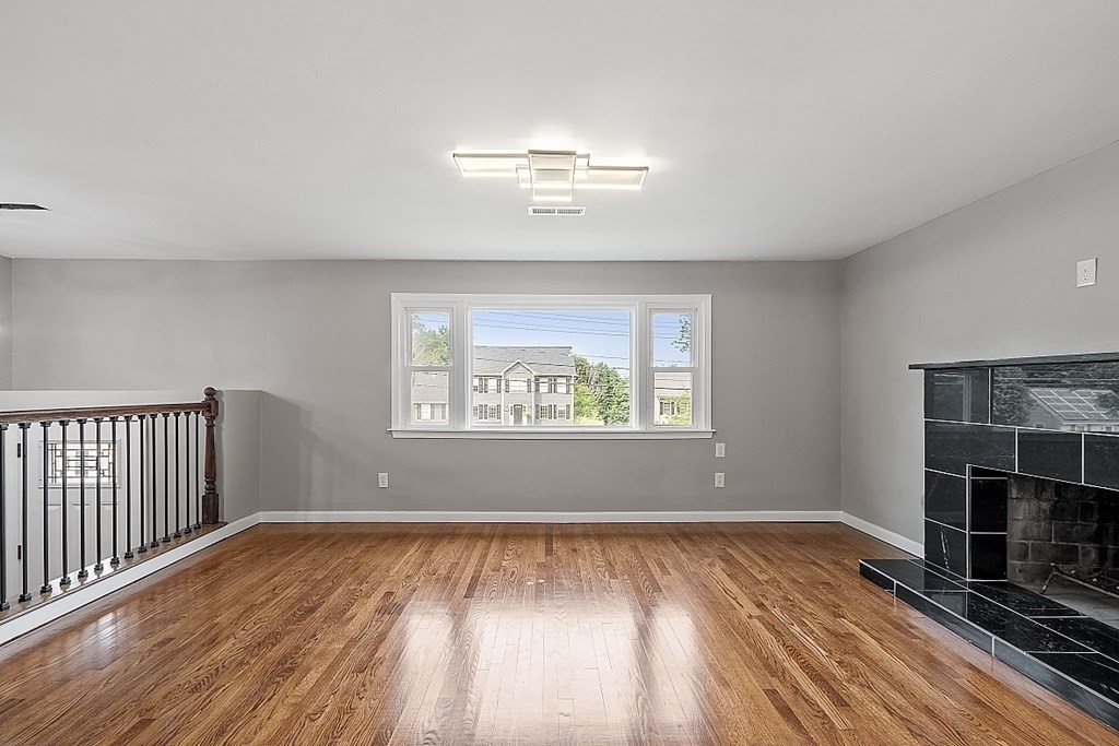 621 Boston Road Billerica, MA 01821 - Photo 5 of 27 wooden floor in an empty room with a window