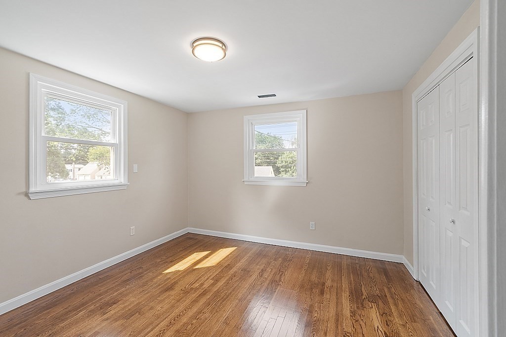 621 Boston Road Billerica, MA 01821 - Photo 8 of 27 a view of empty room with wooden floor and fan