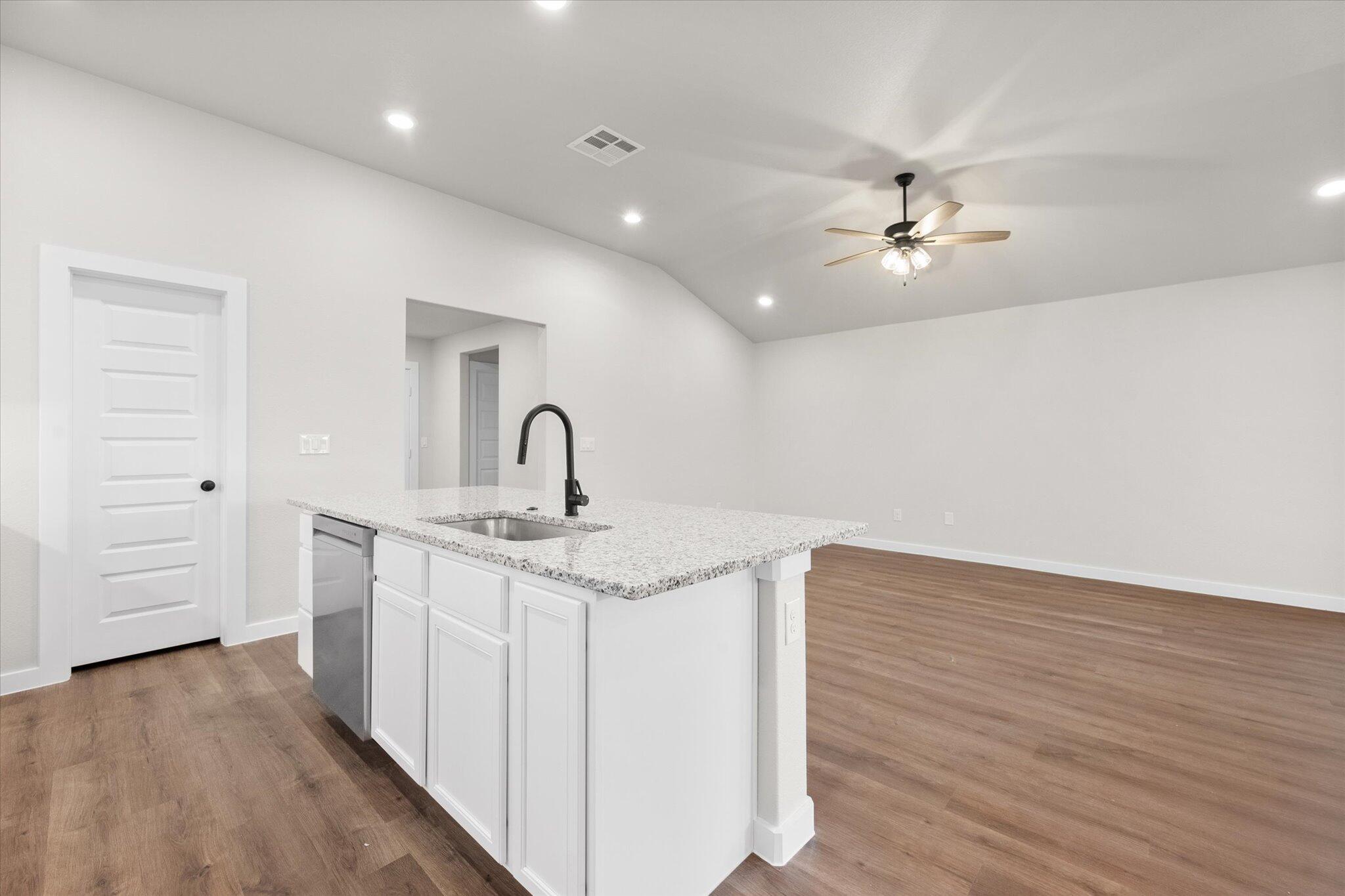 3022 140th Street Lubbock, TX 79423 - Photo 11 of 20 a kitchen with a sink and chandelier
