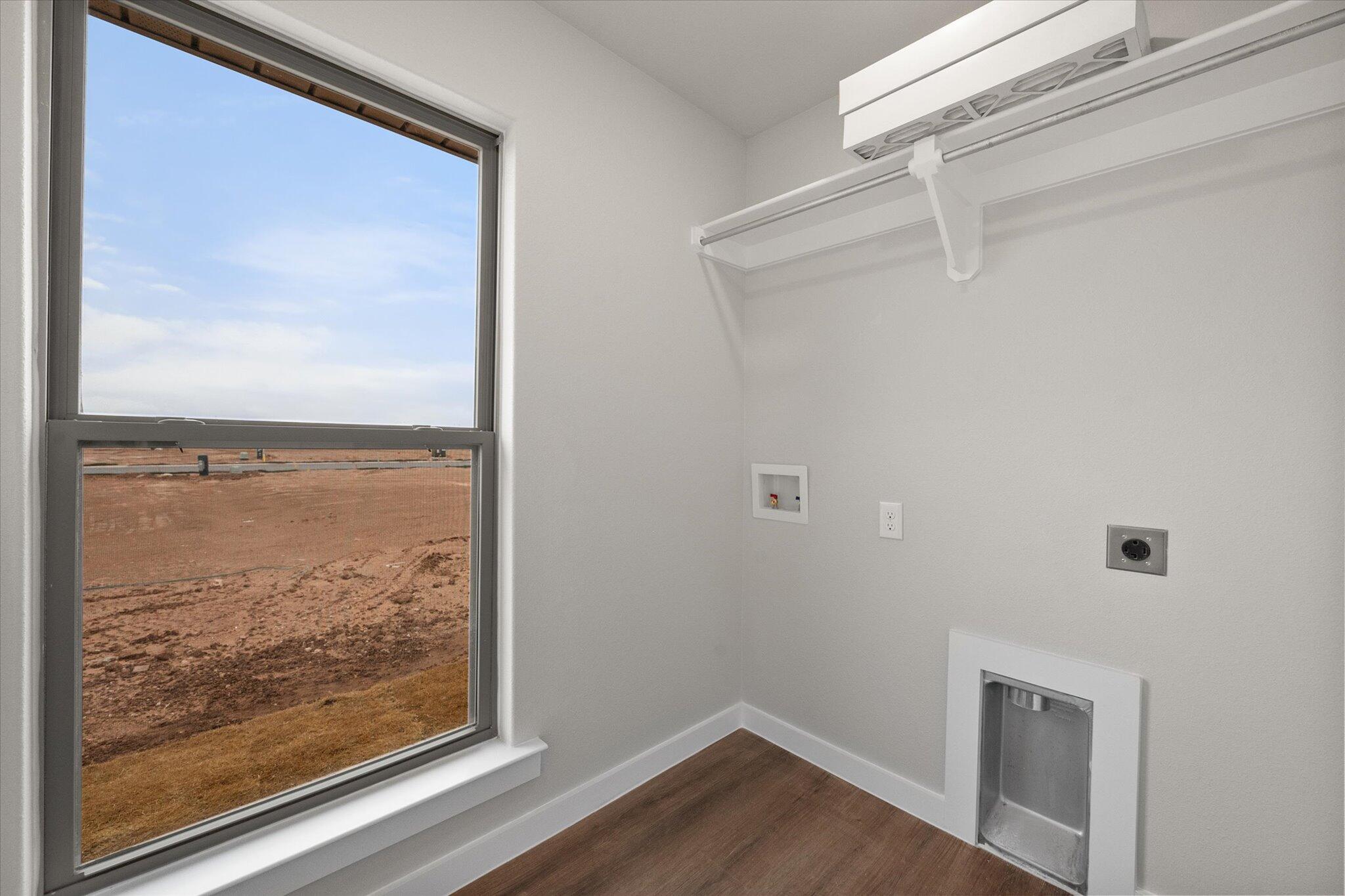 3022 140th Street Lubbock, TX 79423 - Photo 12 of 20 a view of a small space with wooden floor and a window