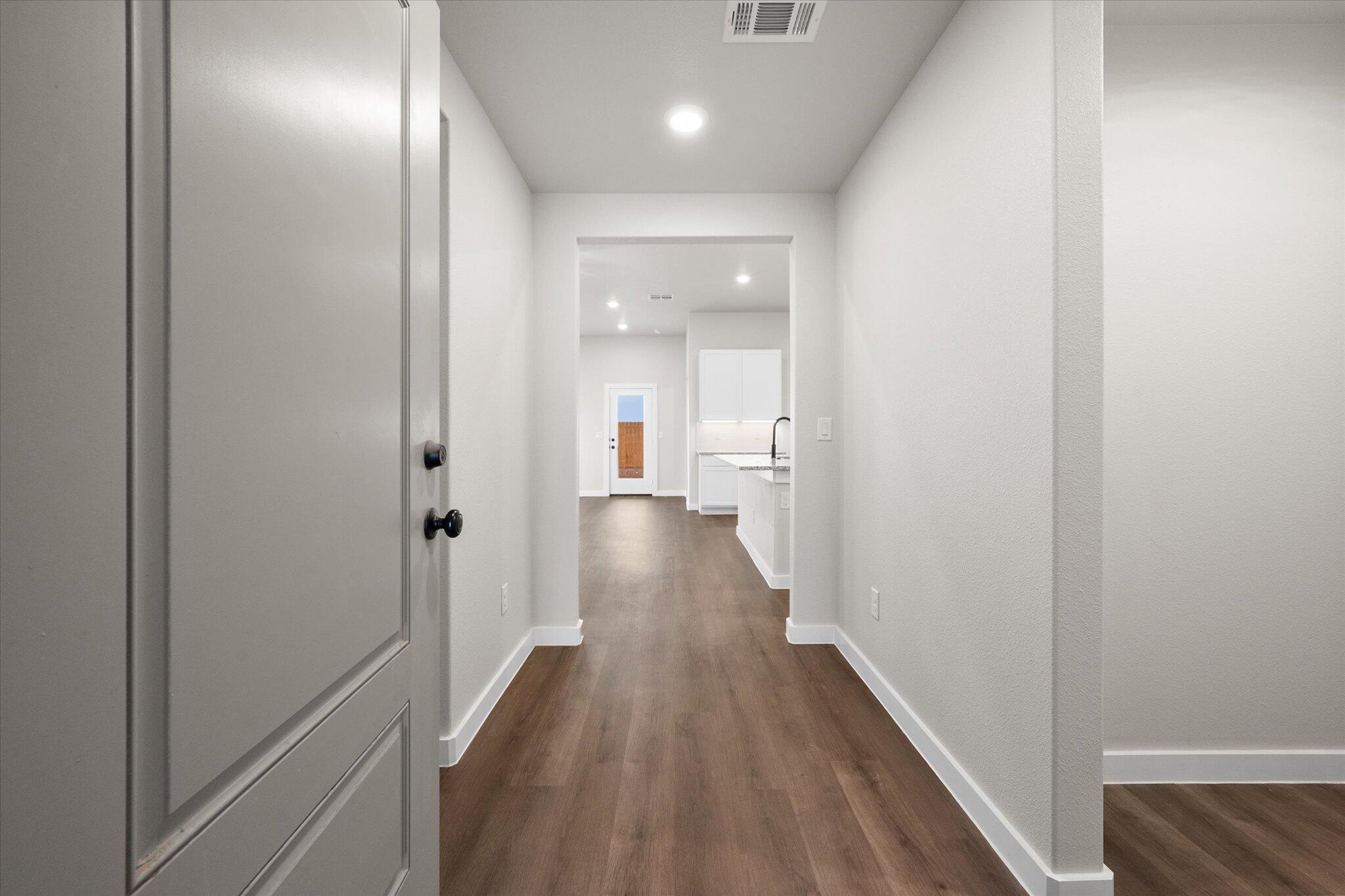 3022 140th Street Lubbock, TX 79423 - Photo 2 of 20 a view of a hallway with wooden floor