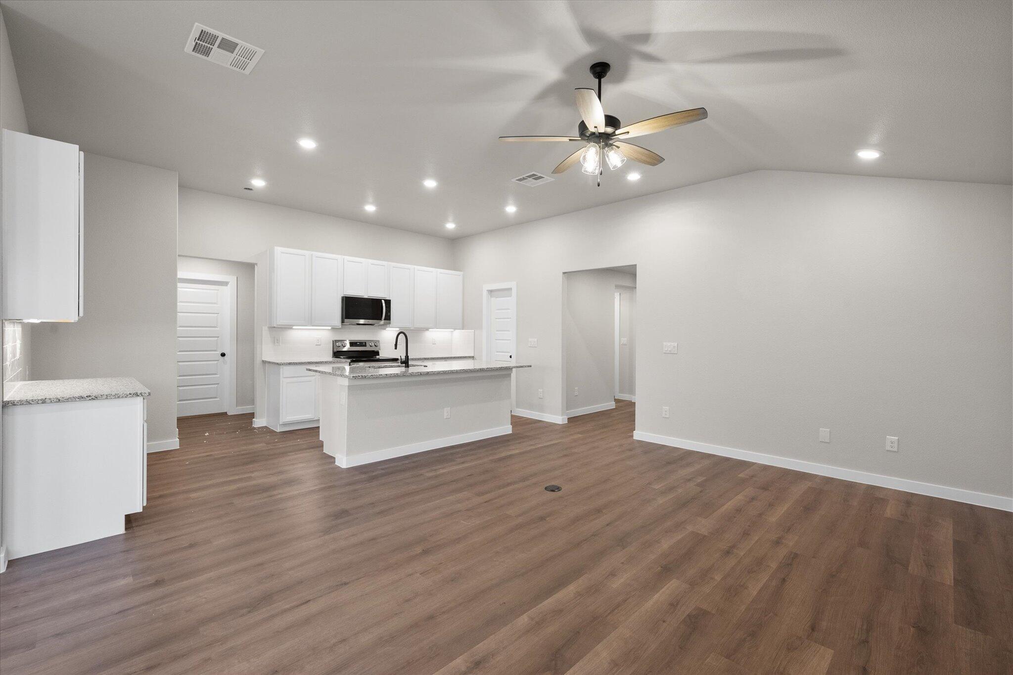 3022 140th Street Lubbock, TX 79423 - Photo 5 of 20 a view of kitchen with granite countertop cabinets and refrigerator