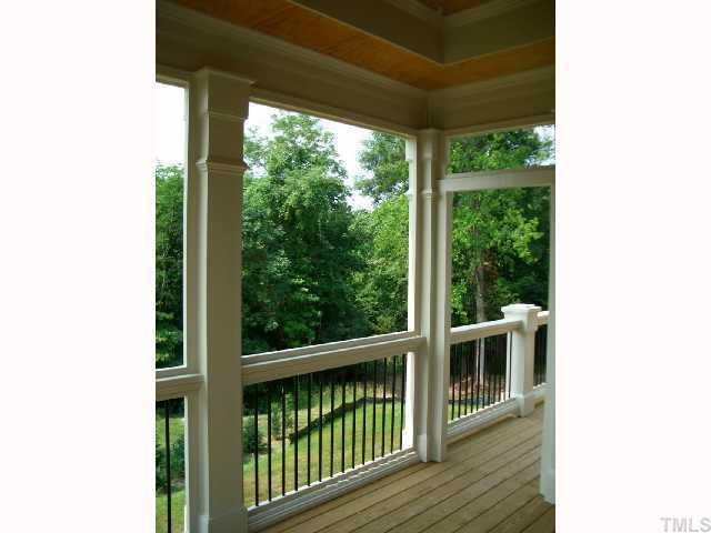 2604 Peachleaf Street, Unit 6025 Raleigh, NC 27614 - Photo 7 of 12 Beautiful wooded area beyond private back yard setting. Screen Porch with double trey ceiling and custom screen panels. Stained beaded ceiling & ceiling fan. Screen Porch continues out to deck. Screened Porch