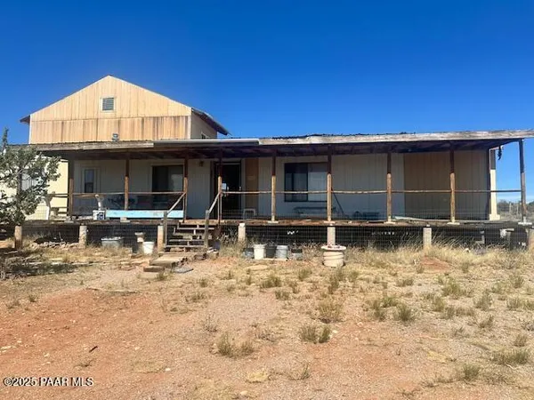 a view of a house with swimming pool