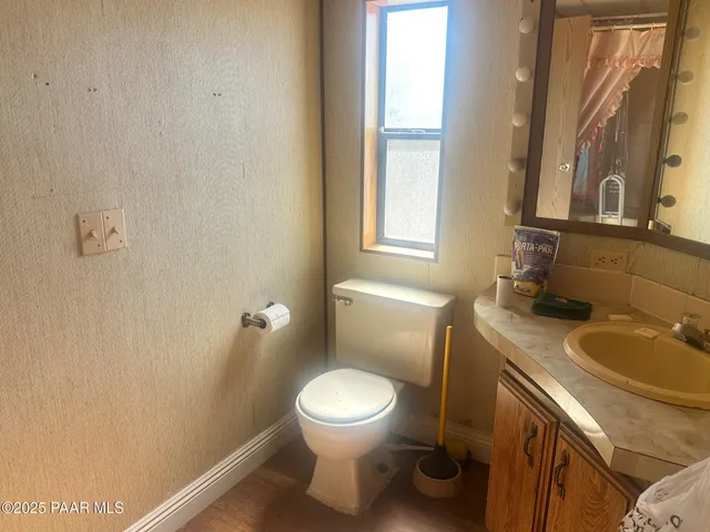 a bathroom with a sink a mirror and shower