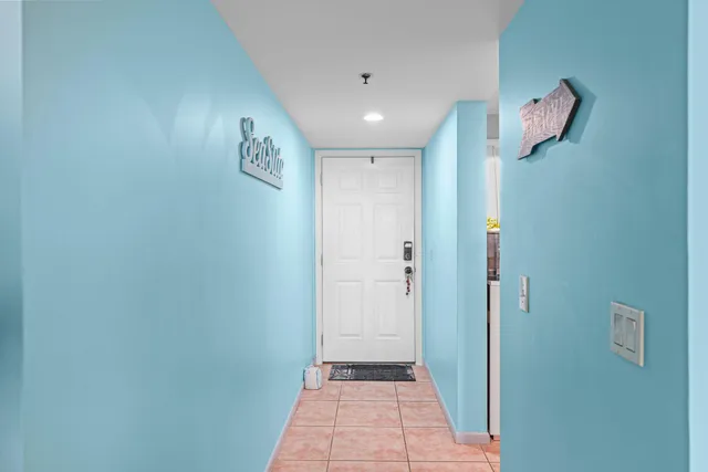 a view of a hallway with front door