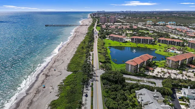 an aerial view of a tennis ground and a yard