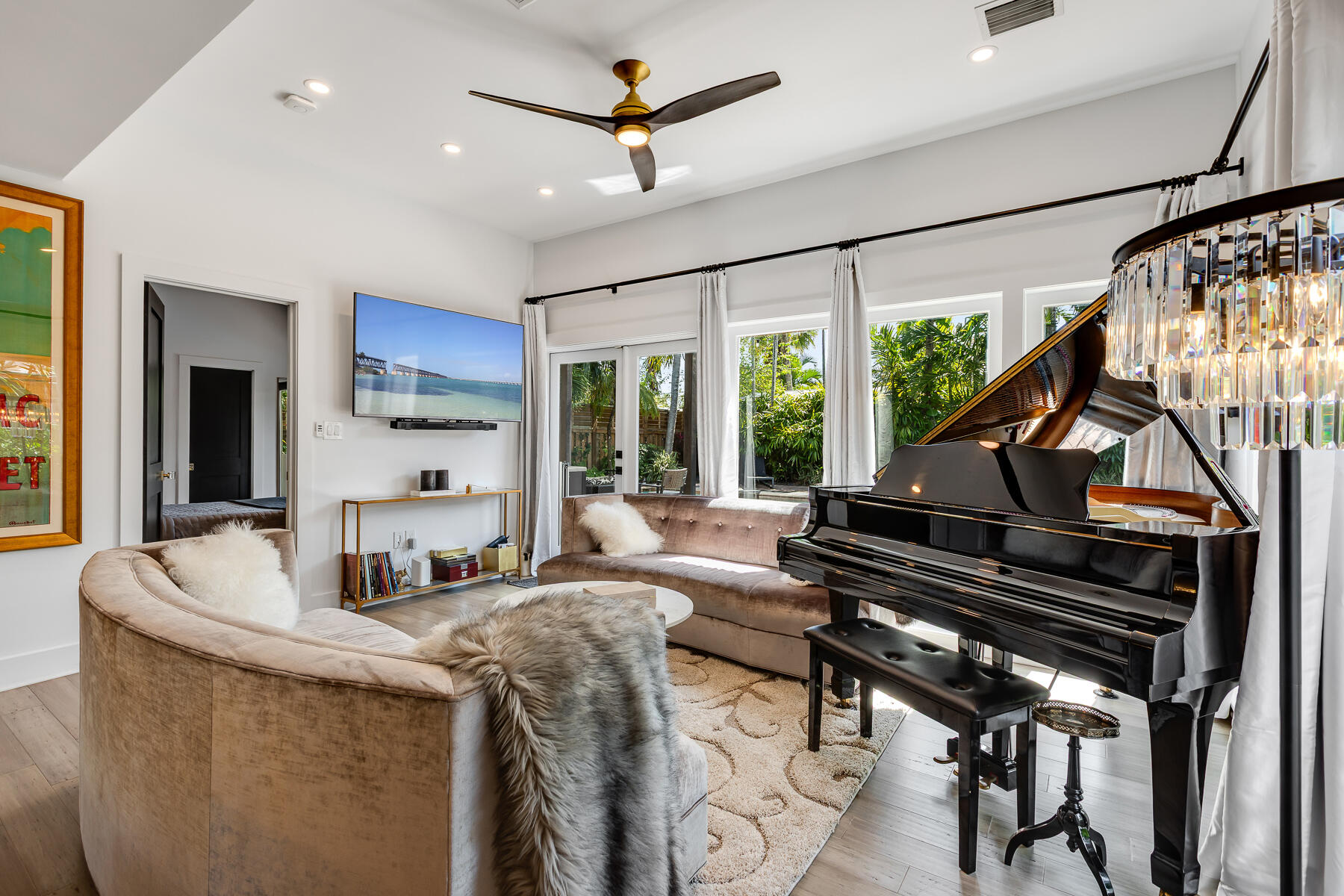 1708 Laird Street Key West, FL 33040 - Photo 12 of 43 a living room with furniture a piano and a flat screen tv