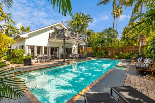 a view of swimming pool from a lounge chair
